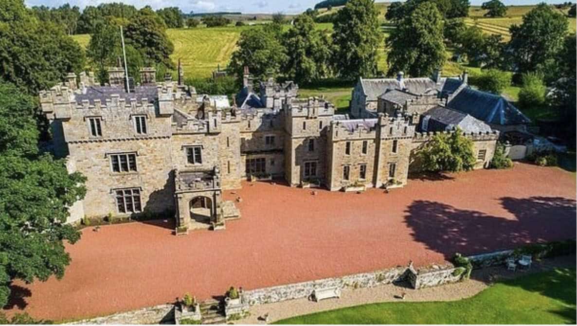 Otterburn Castle, Newcastle photographed from above on a sunny day as part of the Wayne's World Of Wheels Summer 26 Grand Castle Escape Tour