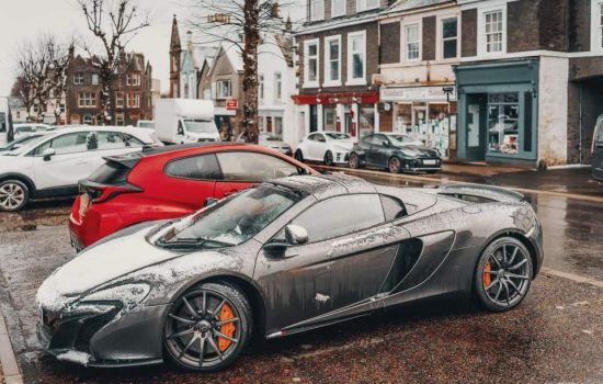 Mclaren 675lt parked in a Scottish town on a Waynes World Of Wheels Scenic Stay